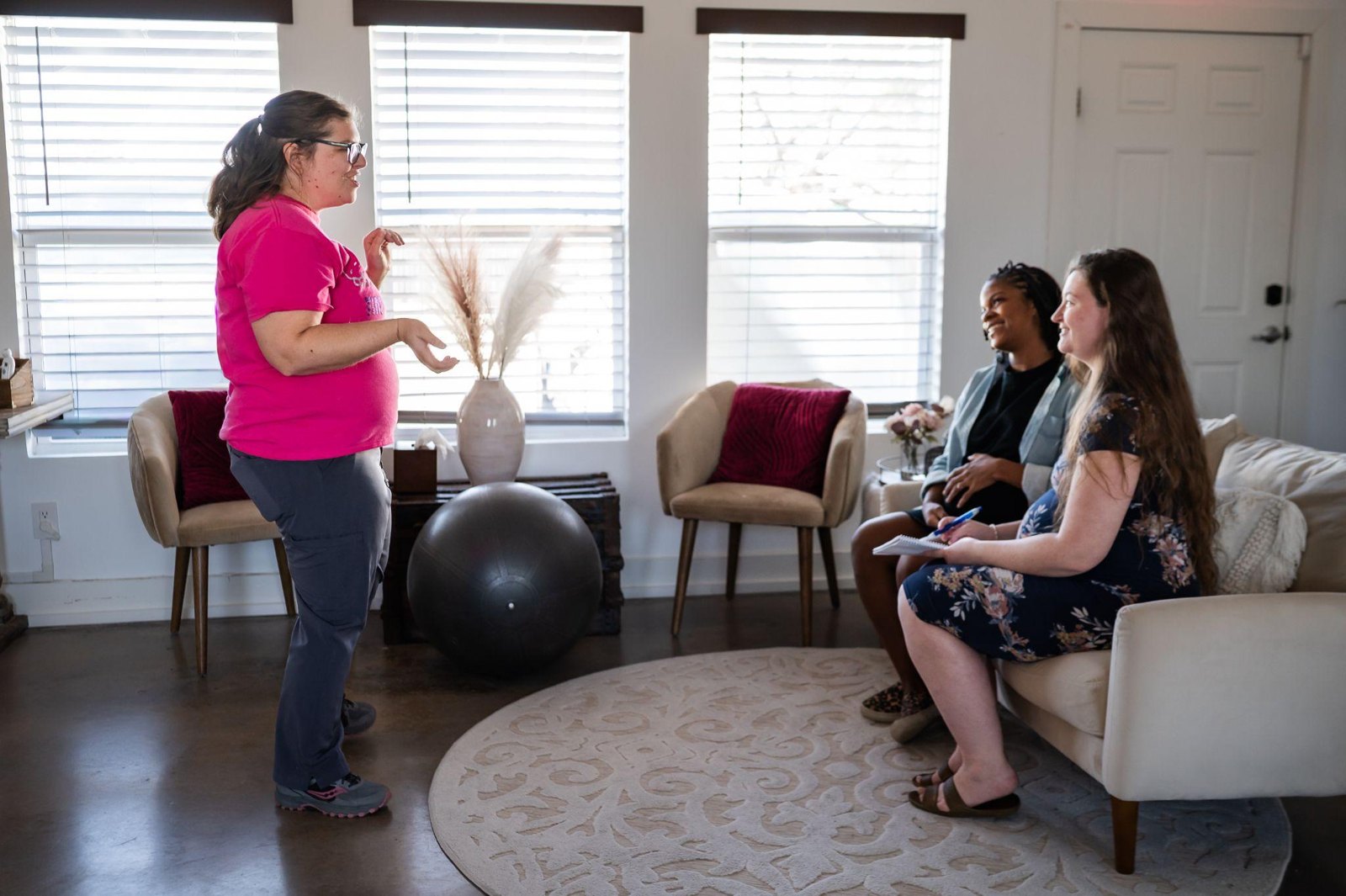 A childbirth educator teaching expectant parents
